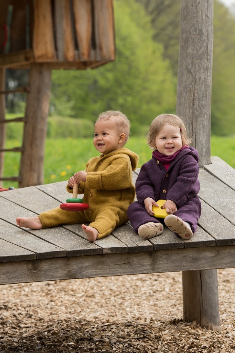 Kurtki merino na wakacje nad Bałtykiem lub w górach - dlaczego to najlepszy wybór? - MINI BÉBÉ